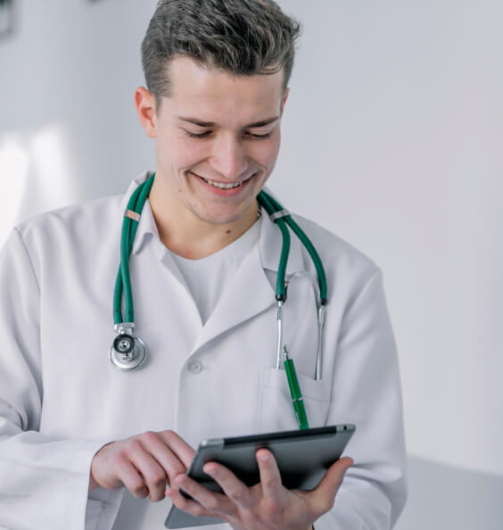 cheerful-young-doctor-using-tablet