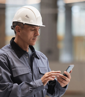 side-view-portrait-mature-worker-using-smartphone